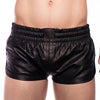 Black leather shorts worn by a person on a white background