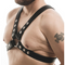 Black leather harness worn by a person on a white background