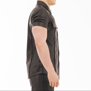 Mannequin wearing a black leather outfit on a white background