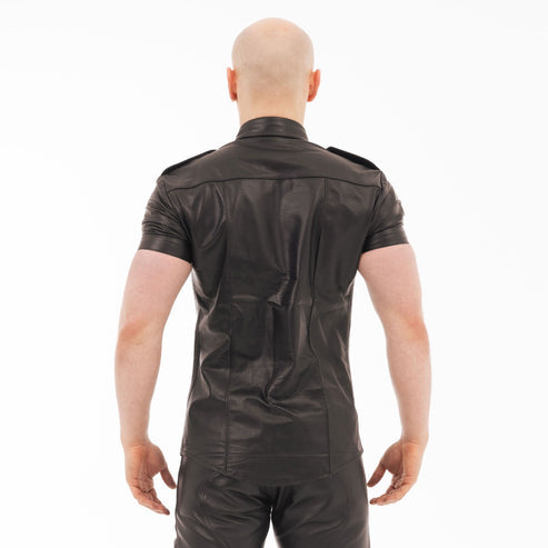 Person wearing a black leather outfit on a white background